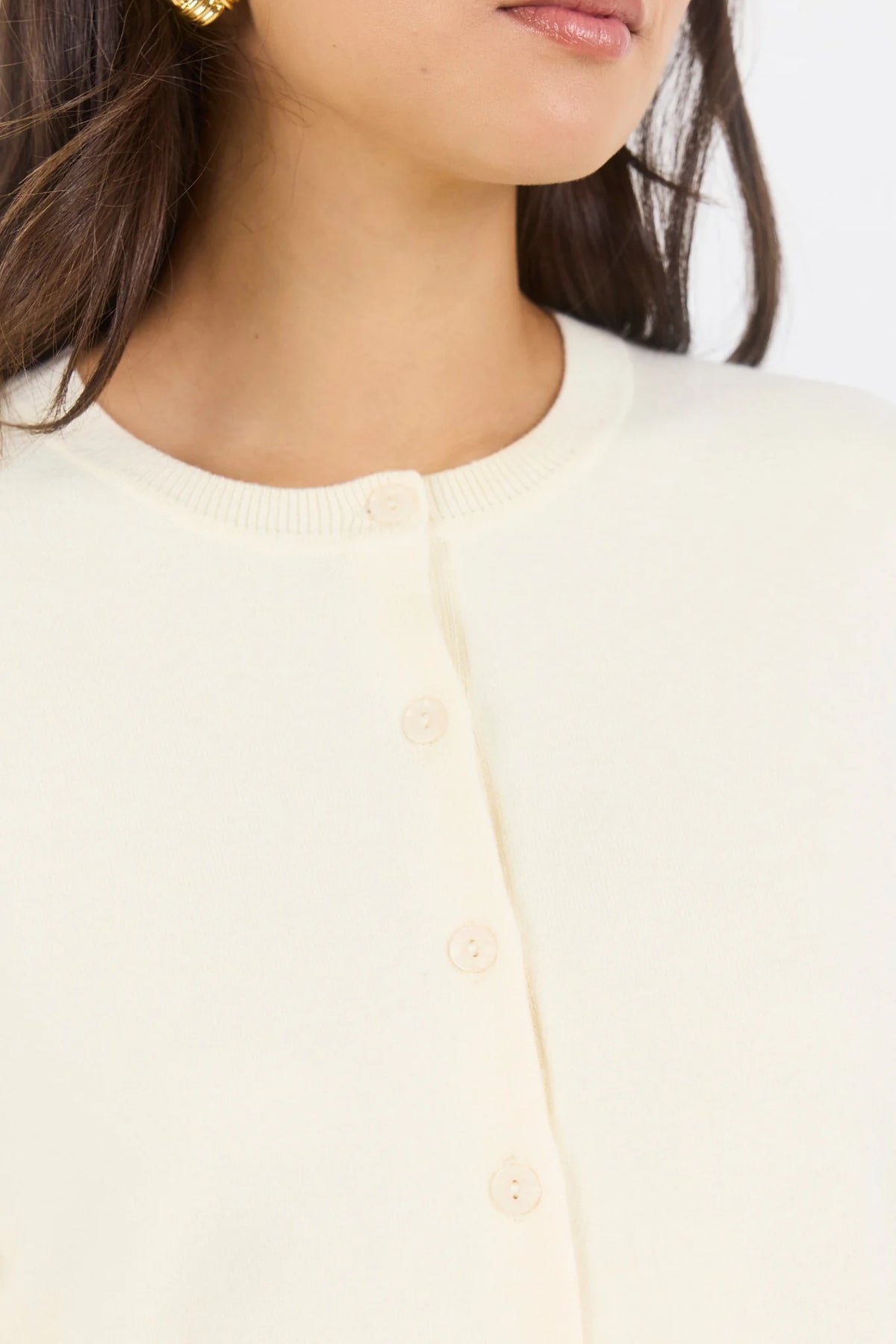 - Long sleeve design
- Crew neckline
- Button-front closure
- Fine gauge knit
- Soft butter colourway
- Ribbed cuffs, neckline and hem
- Fabric - 34% Nylon 34% Viscose 21% Polyester 8% Elastane 3% Cashmere
- Delicate, treat with care