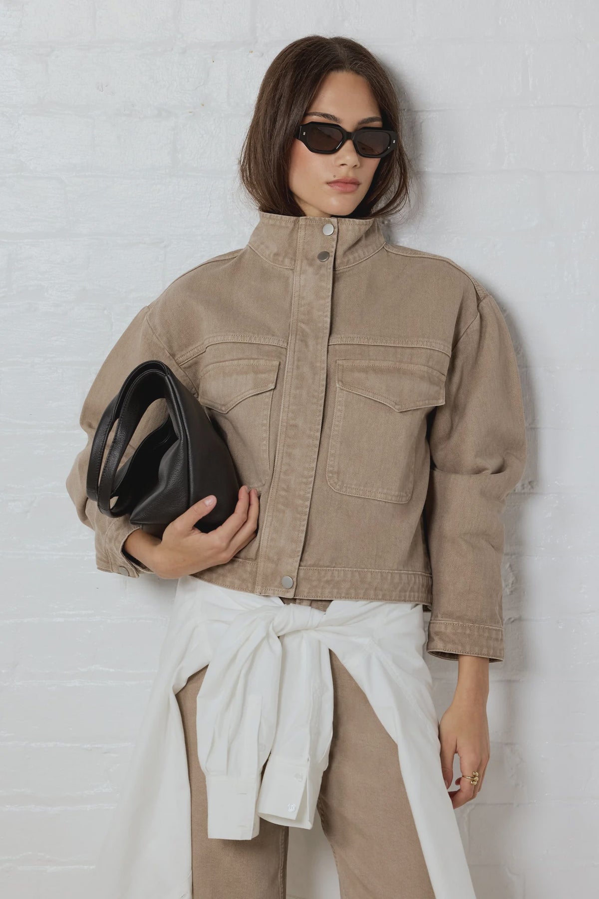- Funnel neckline
- Front patch pockets
- Button front closure
- Plain taupe denim design
- Structured cotton feel
- Fabric Composition - 100% Cotton