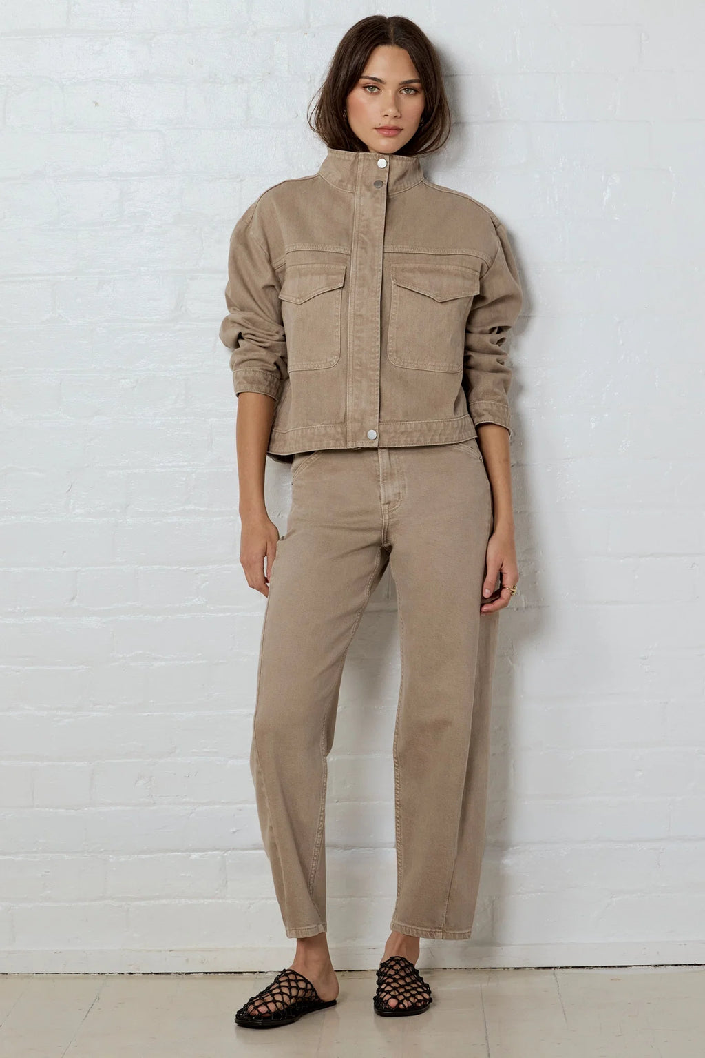 - Funnel neckline
- Front patch pockets
- Button front closure
- Plain taupe denim design
- Structured cotton feel
- Fabric Composition - 100% Cotton