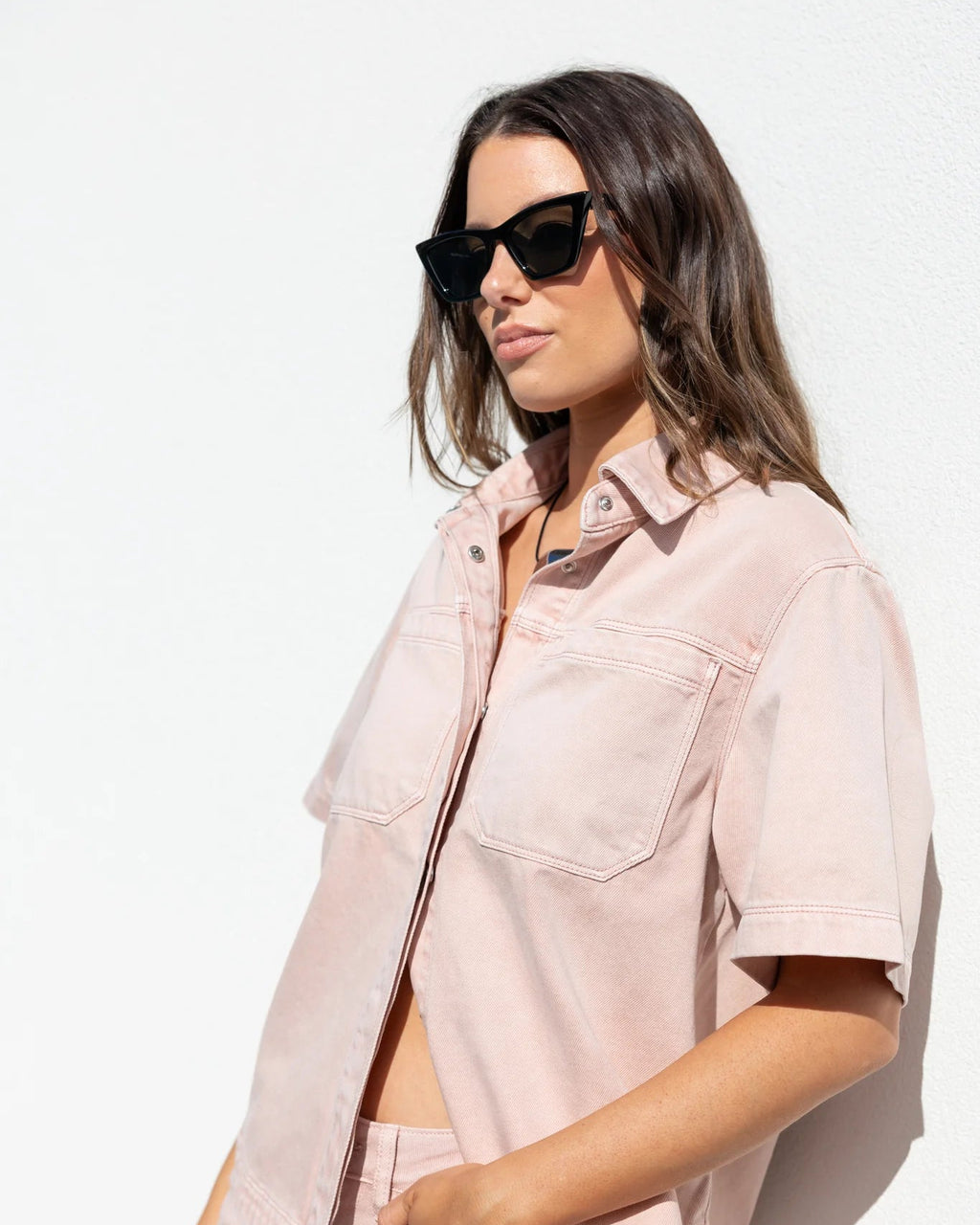 100% cotton for natural softness and breathability

Relaxed short sleeves for all-day comfort

Oversized chest pockets with utilitarian detail

Button front for versatile layering and styling