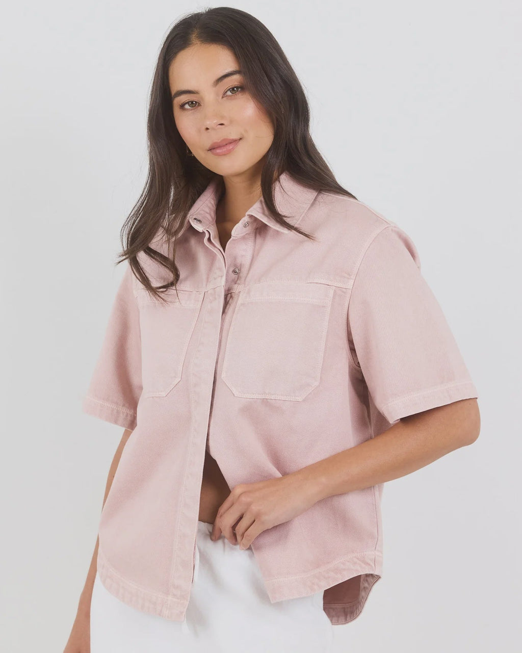 100% cotton for natural softness and breathability

Relaxed short sleeves for all-day comfort

Oversized chest pockets with utilitarian detail

Button front for versatile layering and styling