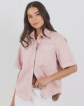 100% cotton for natural softness and breathability

Relaxed short sleeves for all-day comfort

Oversized chest pockets with utilitarian detail

Button front for versatile layering and styling
