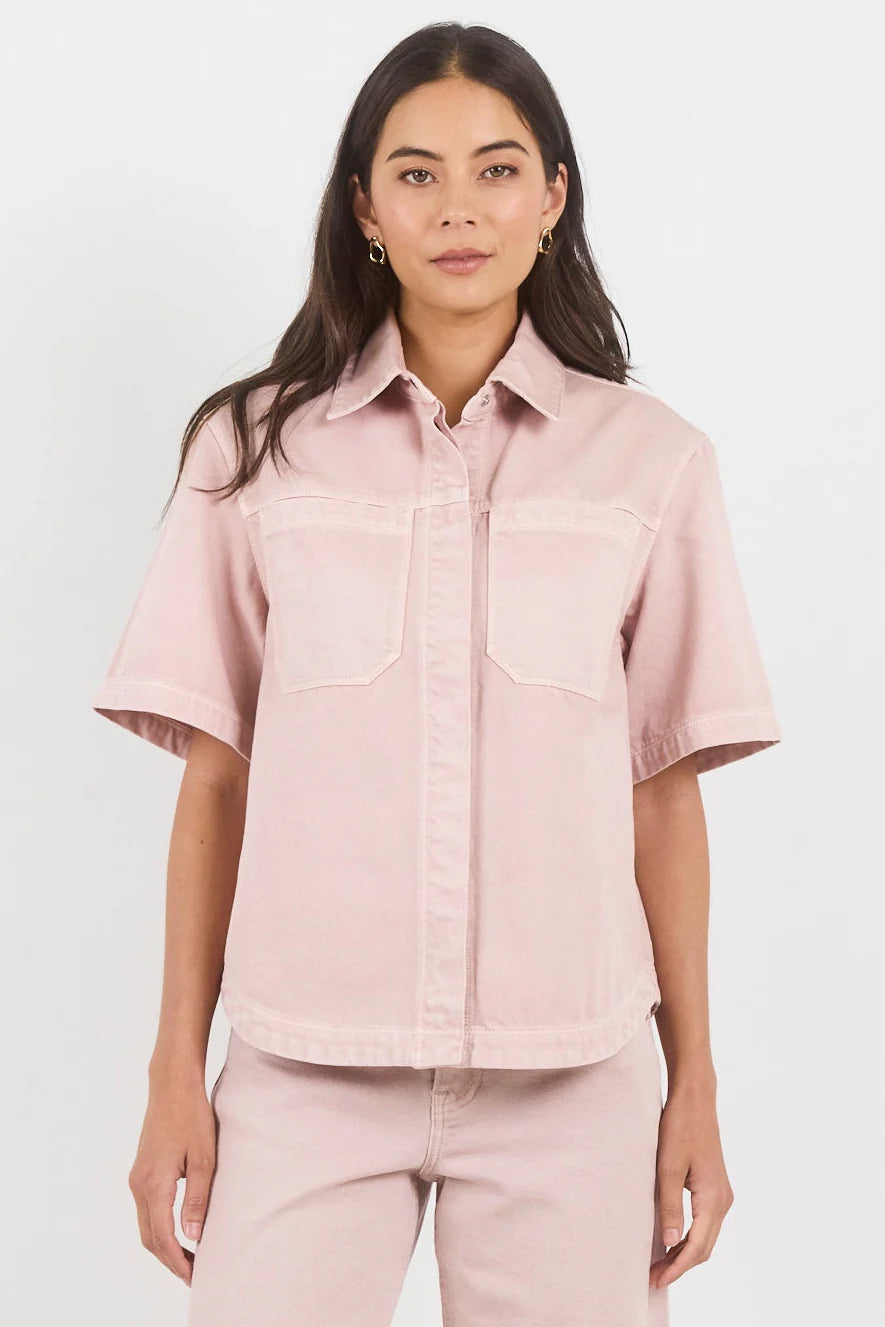 100% cotton for natural softness and breathability

Relaxed short sleeves for all-day comfort

Oversized chest pockets with utilitarian detail

Button front for versatile layering and styling