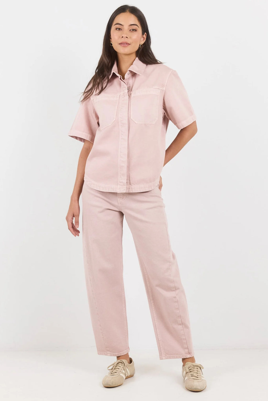 100% cotton for natural softness and breathability

Relaxed short sleeves for all-day comfort

Oversized chest pockets with utilitarian detail

Button front for versatile layering and styling