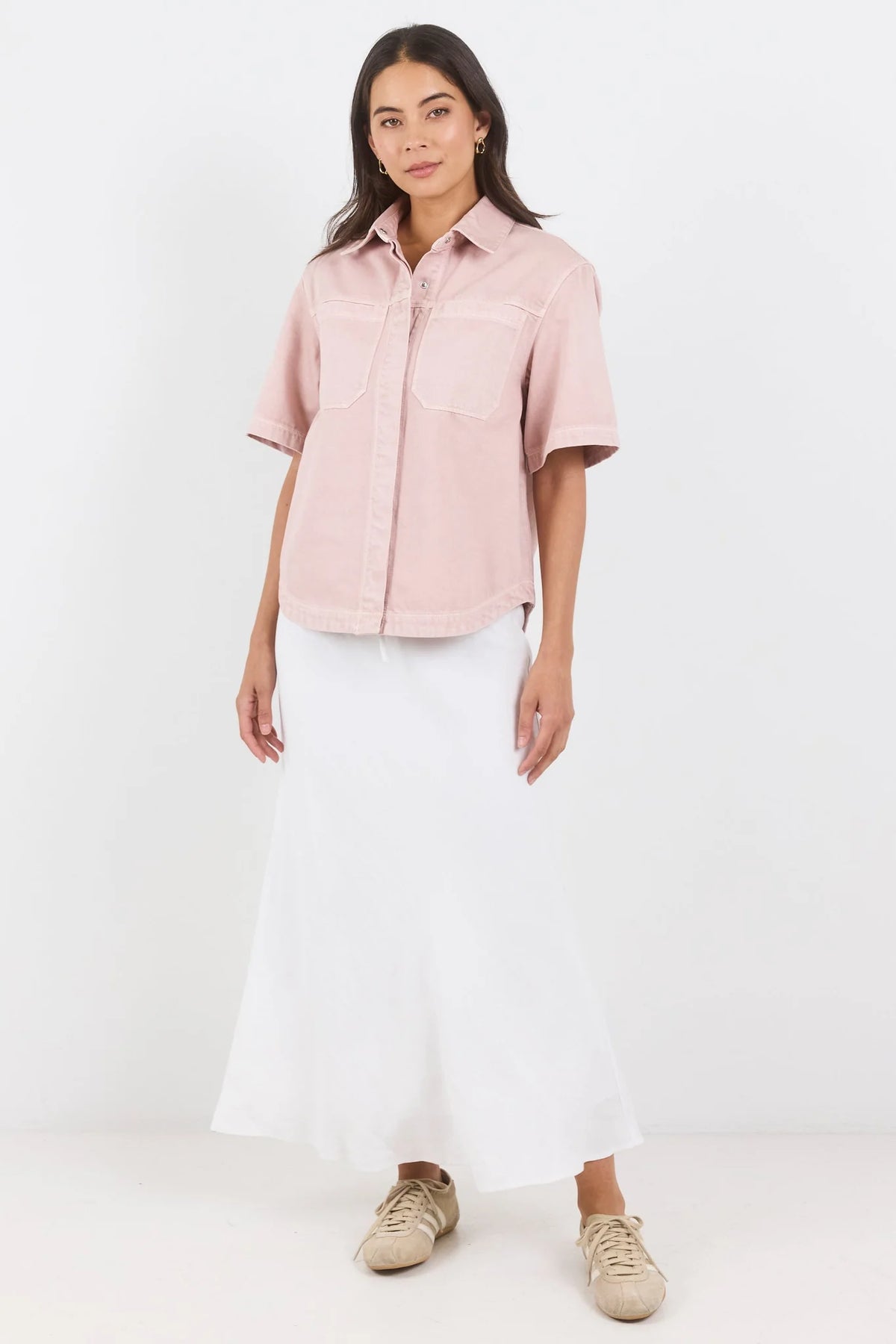 100% cotton for natural softness and breathability

Relaxed short sleeves for all-day comfort

Oversized chest pockets with utilitarian detail

Button front for versatile layering and styling