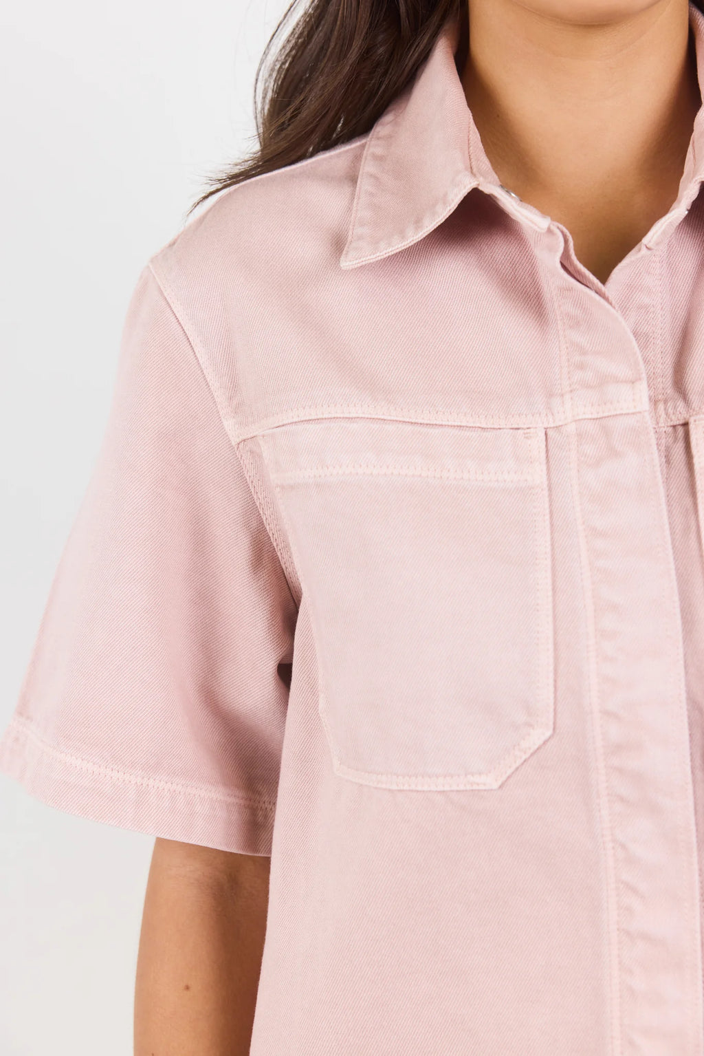 100% cotton for natural softness and breathability

Relaxed short sleeves for all-day comfort

Oversized chest pockets with utilitarian detail

Button front for versatile layering and styling