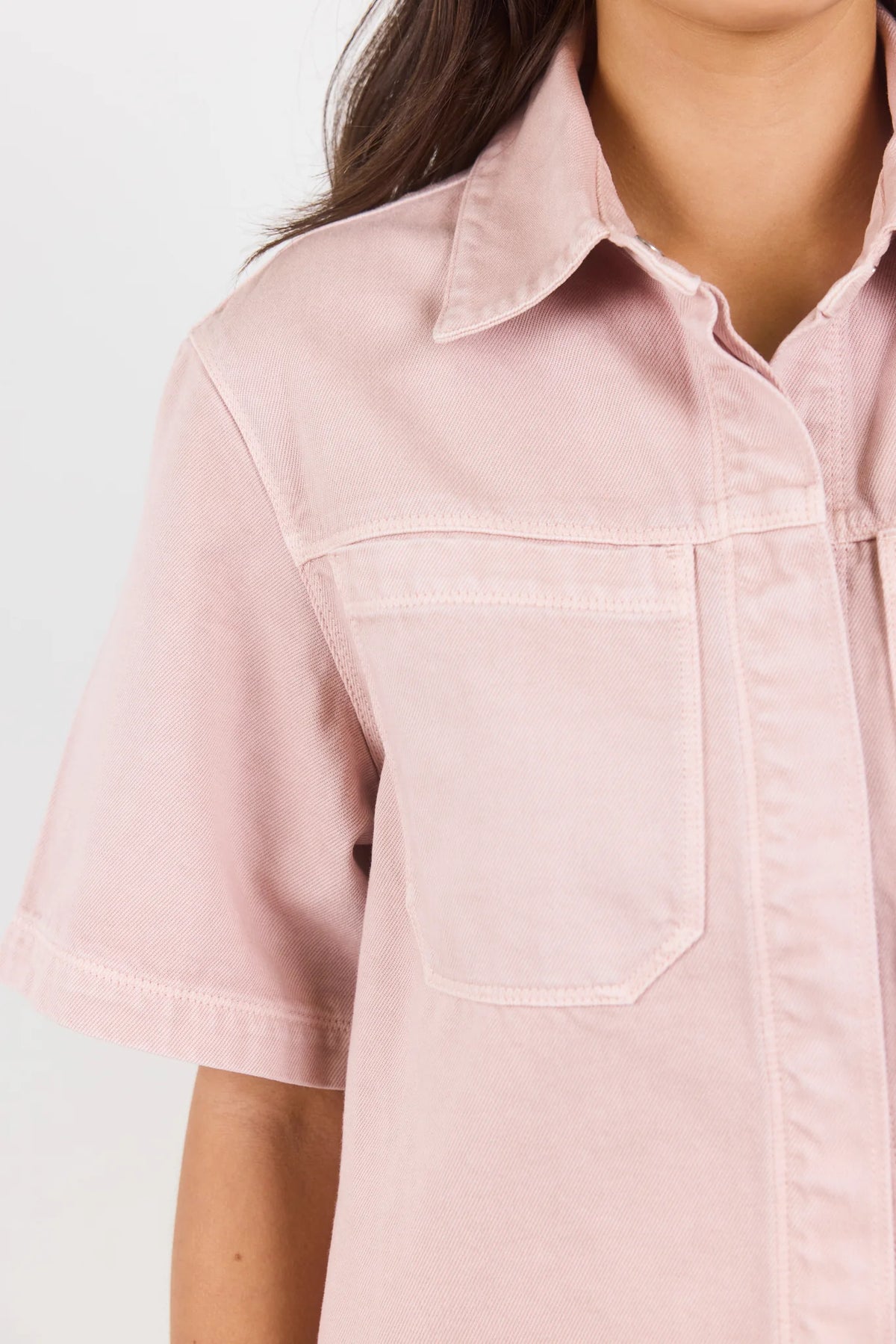 100% cotton for natural softness and breathability

Relaxed short sleeves for all-day comfort

Oversized chest pockets with utilitarian detail

Button front for versatile layering and styling