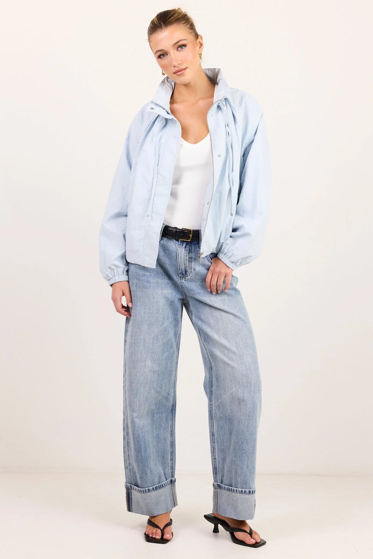 - High funnel neckline
- Long sleeves with elasticated cuffs
- Concealed zip-front fastening
- Adjustable neckline ties
- Relaxed oversized fit
- Elasticated hem
- Side pockets
- Fabric Composition - 100% Nylon