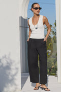 Mid-rise waist

Front pleat detailing

Modern barrel-leg silhouette

Relaxed fit through the leg

Zip-front fastening

Full-length design

50% Cotton, 50% Lyocell