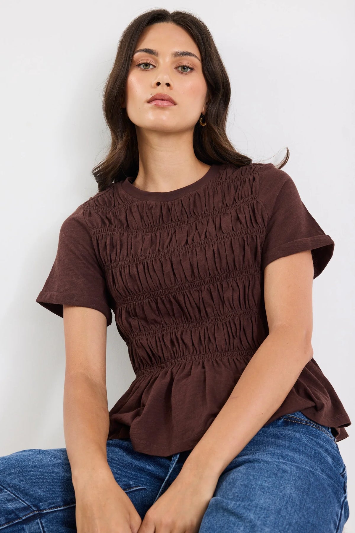 Classic crew neckline

Short sleeves for everyday ease

All-over shirred bodice for a flattering fit

Soft peplum hem adds feminine shape

Easy pull-on design

Made from natural fibres

Fabric composition: 100% cotton