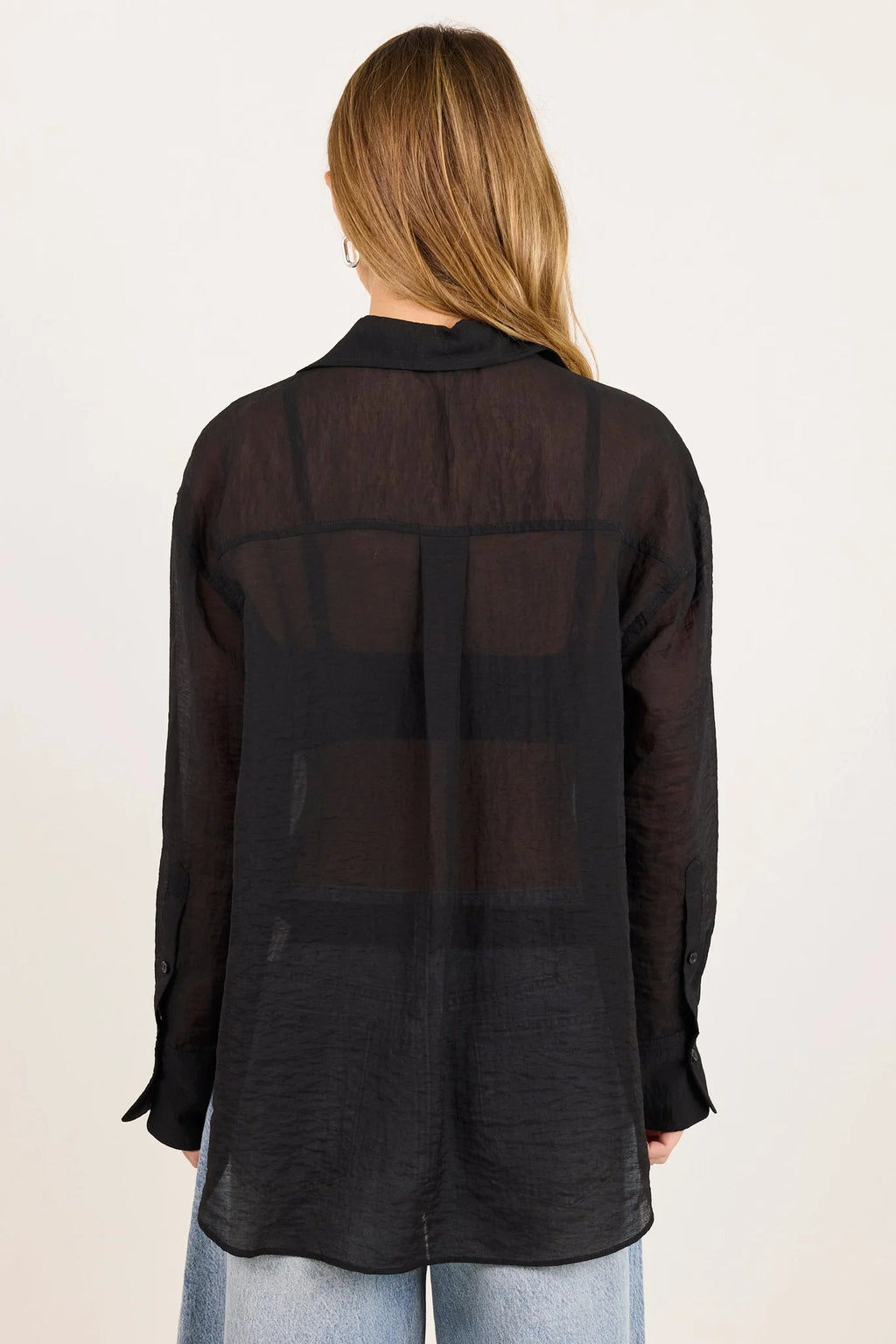 - Classic collar
- Long sleeves
- Button-through front
- Relaxed oversized fit
- Semi-sheer fabrication
- Delicate garment care
- Fabric Composition - 70% Viscose 30% Nylon
