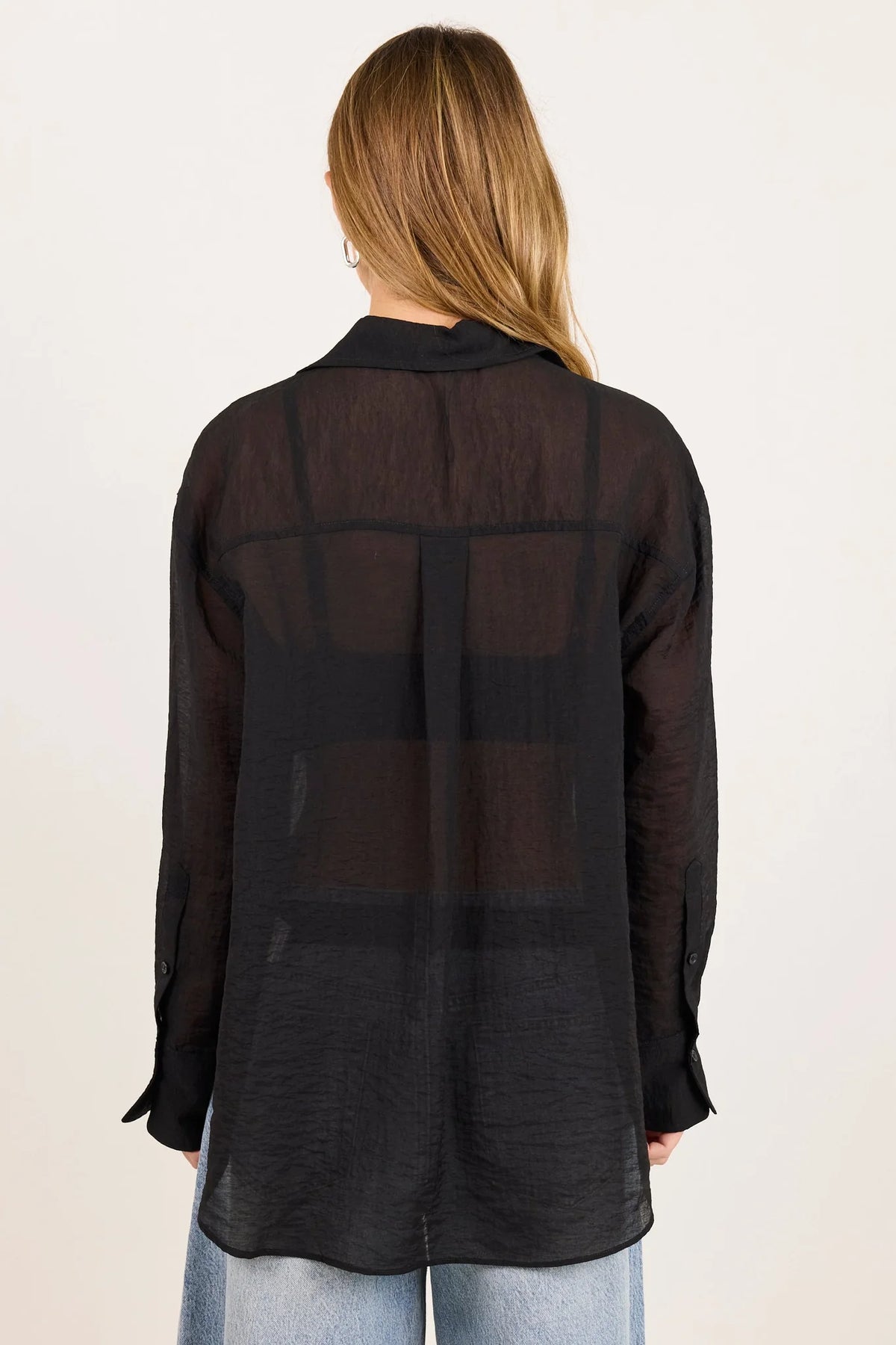 - Classic collar
- Long sleeves
- Button-through front
- Relaxed oversized fit
- Semi-sheer fabrication
- Delicate garment care
- Fabric Composition - 70% Viscose 30% Nylon