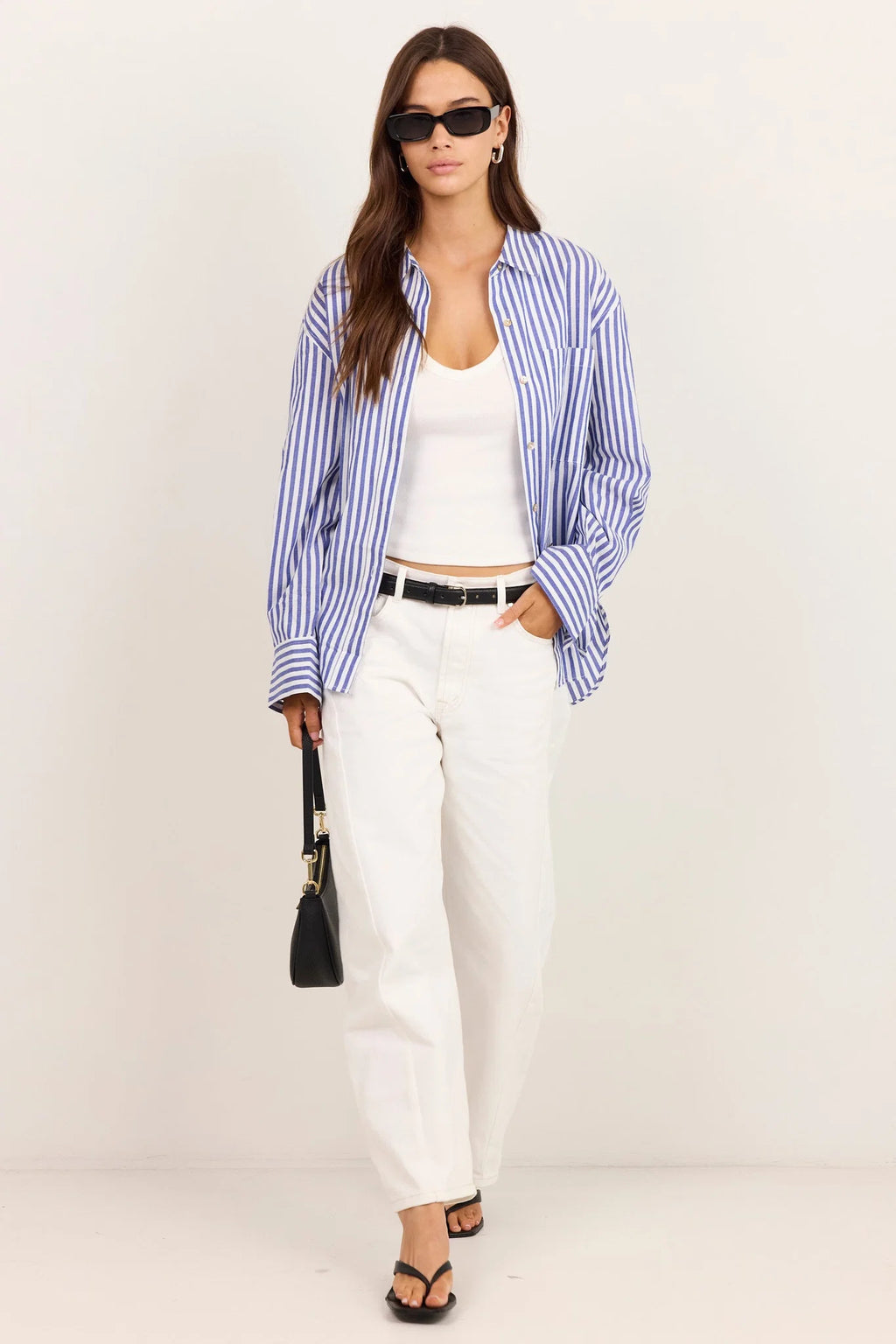 - Long sleeve design
- Button front
- Oversized fit
- Fabric Composition 100% Cotton