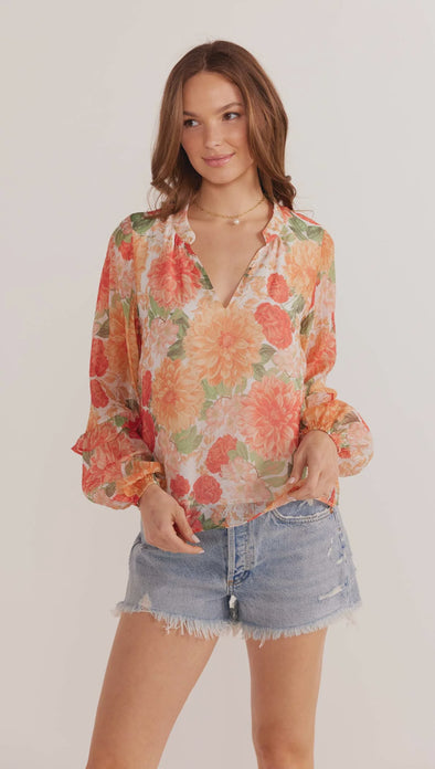 The Aida Long Sleeve Blouse is the top you need when you want to be comfy but be bold in a signature print. Floaty silhouettes and blooming florals all exclusive to MINKPINK. Style with your favourite denim bottoms or white linen for a summer classic look that will keep you cool and looking fabulous.

- Exclusive MINKPINK print
- Regular length
- Full length sleeves
- V neckline
- Lined

Our model is 175cm tall and wears a size Small

75% Viscose 25% Polyamide, Lining: 100% Viscose
- Hand wash with mild soa