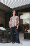 Floral blouse with three-quarter voluminous sleeves

Back button detailing for a chic touch

Relaxed silhouette perfect for summer styling

Crafted from 85% Tencel, 15% Nylon for softness and breathability

A versatile piece to dress up or down with ease