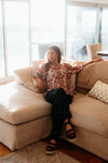 Floral blouse with three-quarter voluminous sleeves

Back button detailing for a chic touch

Relaxed silhouette perfect for summer styling

Crafted from 85% Tencel, 15% Nylon for softness and breathability

A versatile piece to dress up or down with ease