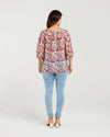 Floral blouse with three-quarter voluminous sleeves

Back button detailing for a chic touch

Relaxed silhouette perfect for summer styling

Crafted from 85% Tencel, 15% Nylon for softness and breathability

A versatile piece to dress up or down with ease