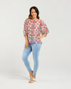 Floral blouse with three-quarter voluminous sleeves

Back button detailing for a chic touch

Relaxed silhouette perfect for summer styling

Crafted from 85% Tencel, 15% Nylon for softness and breathability

A versatile piece to dress up or down with ease