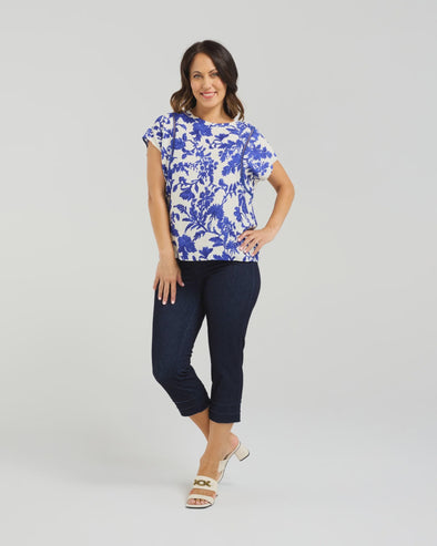 Short sleeve blouse in a bold cobalt floral print

Feminine lace trim accents on the sleeves

Relaxed, easy-to-wear fit with flattering drape

Lightweight 80% Viscose, 20% Nylon blend

A versatile piece for day-to-night styling