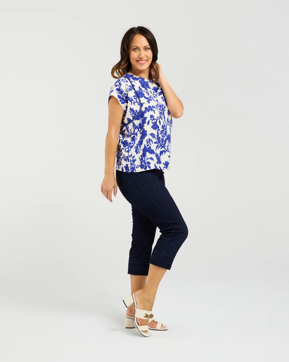Short sleeve blouse in a bold cobalt floral print

Feminine lace trim accents on the sleeves

Relaxed, easy-to-wear fit with flattering drape

Lightweight 80% Viscose, 20% Nylon blend

A versatile piece for day-to-night styling
