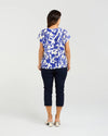 Short sleeve blouse in a bold cobalt floral print

Feminine lace trim accents on the sleeves

Relaxed, easy-to-wear fit with flattering drape

Lightweight 80% Viscose, 20% Nylon blend

A versatile piece for day-to-night styling