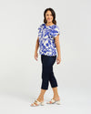 Short sleeve blouse in a bold cobalt floral print

Feminine lace trim accents on the sleeves

Relaxed, easy-to-wear fit with flattering drape

Lightweight 80% Viscose, 20% Nylon blend

A versatile piece for day-to-night styling