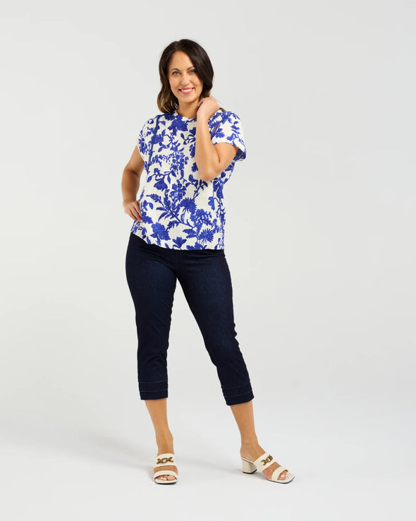 Short sleeve blouse in a bold cobalt floral print

Feminine lace trim accents on the sleeves

Relaxed, easy-to-wear fit with flattering drape

Lightweight 80% Viscose, 20% Nylon blend

A versatile piece for day-to-night styling