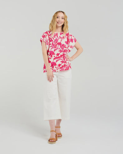 Short sleeve blouse in a vibrant magenta floral print

Romantic lace trim detailing at the sleeves

Relaxed, flattering fit for versatile styling

Lightweight 80% Viscose, 20% Nylon blend

Easy to style from casual to elevated occasions
