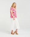 Short sleeve blouse in a vibrant magenta floral print

Romantic lace trim detailing at the sleeves

Relaxed, flattering fit for versatile styling

Lightweight 80% Viscose, 20% Nylon blend

Easy to style from casual to elevated occasions