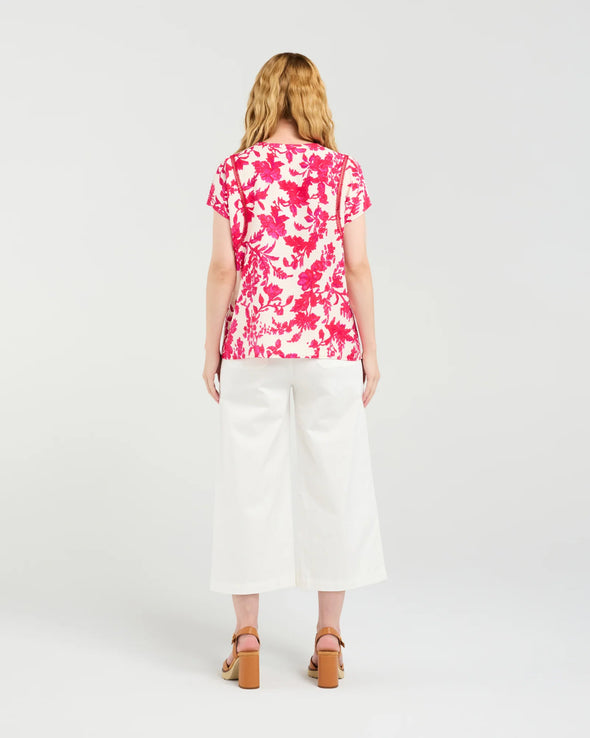 Short sleeve blouse in a vibrant magenta floral print

Romantic lace trim detailing at the sleeves

Relaxed, flattering fit for versatile styling

Lightweight 80% Viscose, 20% Nylon blend

Easy to style from casual to elevated occasions