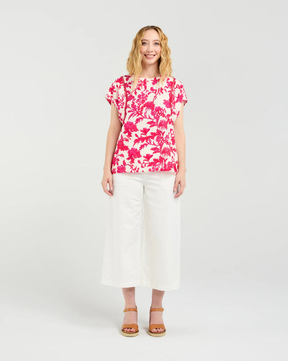 Short sleeve blouse in a vibrant magenta floral print

Romantic lace trim detailing at the sleeves

Relaxed, flattering fit for versatile styling

Lightweight 80% Viscose, 20% Nylon blend

Easy to style from casual to elevated occasions