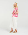 Short sleeve blouse in a vibrant magenta floral print

Romantic lace trim detailing at the sleeves

Relaxed, flattering fit for versatile styling

Lightweight 80% Viscose, 20% Nylon blend

Easy to style from casual to elevated occasions