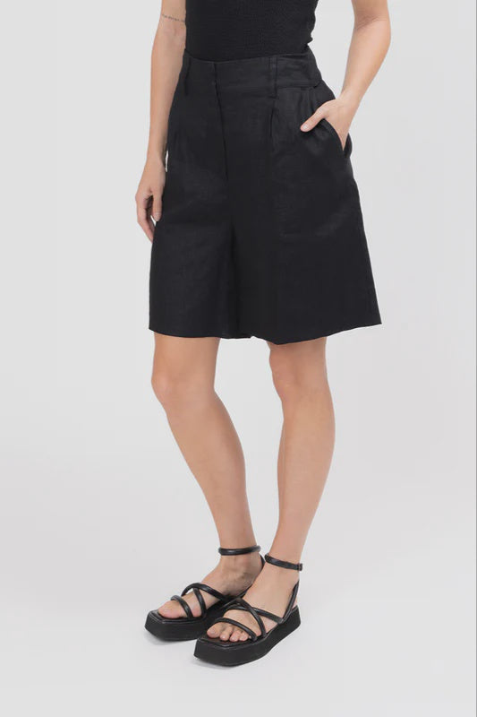 High-waisted fit with a sleek fly front and hook closure

Elasticated waistband at the back for comfort

Relaxed wide-leg silhouette

Functional pockets for everyday ease

Belt loops for versatile styling

Made from breathable 100% linen

Standard fit with no stretch