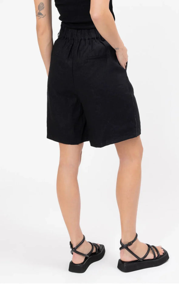 High-waisted fit with a sleek fly front and hook closure

Elasticated waistband at the back for comfort

Relaxed wide-leg silhouette

Functional pockets for everyday ease

Belt loops for versatile styling

Made from breathable 100% linen

Standard fit with no stretch