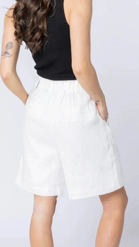 High-waisted fit with a sleek fly front and hook closure

Elasticated waistband at the back for comfort

Relaxed wide-leg silhouette

Functional pockets for everyday ease

Belt loops for versatile styling

Made from breathable 100% linen

Standard fit with no stretch