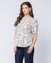 Classic button-front design

Shirred panels across the body for added texture

Crew neckline for a timeless finish

Elasticated ruffle cuffs on elbow-length sleeves

All-over pattern for a feminine touch

Made from 100% breathable cotton

Standard fit, no stretch other than in shirring
