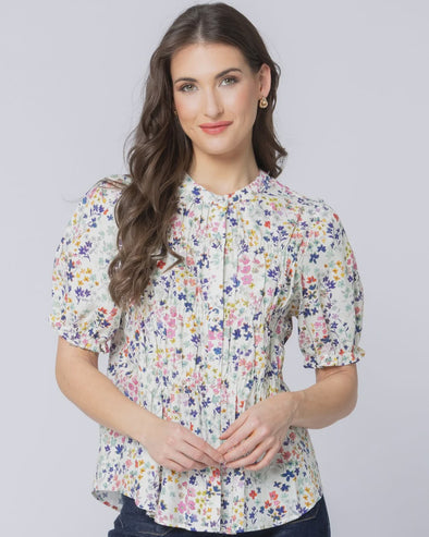 Classic button-front design

Shirred panels across the body for added texture

Crew neckline for a timeless finish

Elasticated ruffle cuffs on elbow-length sleeves

All-over pattern for a feminine touch

Made from 100% breathable cotton

Standard fit, no stretch other than in shirring