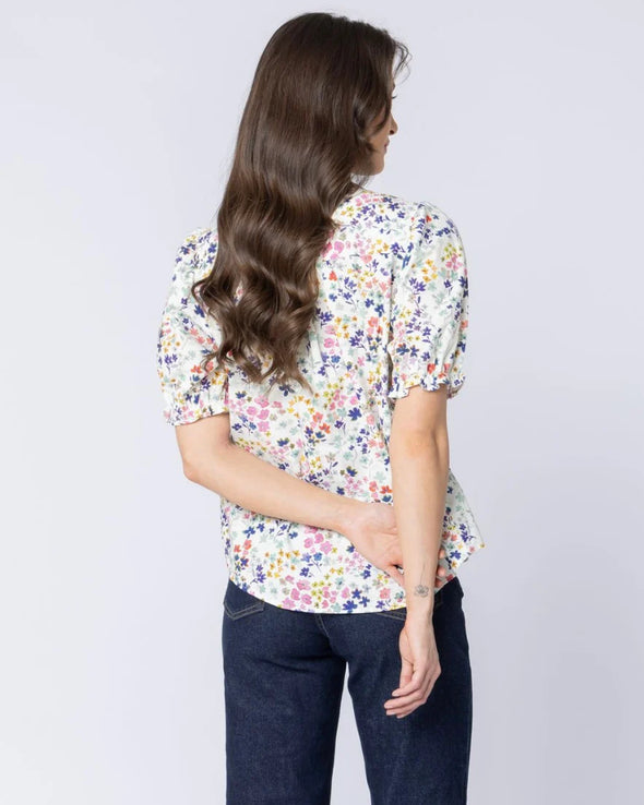 Classic button-front design

Shirred panels across the body for added texture

Crew neckline for a timeless finish

Elasticated ruffle cuffs on elbow-length sleeves

All-over pattern for a feminine touch

Made from 100% breathable cotton

Standard fit, no stretch other than in shirring