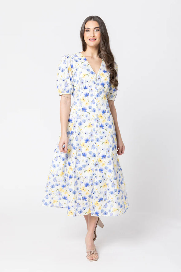 Midi length for a versatile silhouette

Flattering V-neckline

Puffed short sleeves for a romantic touch

Button-down front closure

Lightweight and breathable fabric