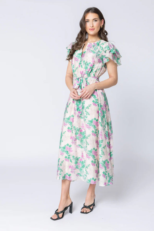 Elegant floral print in the signature Zen Garden pattern

V-neckline with collar and subtle hook-and-eye closure

Short double-layered butterfly sleeves for a feminine finish

Elasticated waist with removable tie belt for a flattering silhouette

Maxi length with soft, graceful movement

Comfortable cotton lining

Main Fabric: 73% Tencel, 11% Linen, 16% Nylon

Lining: 100% Cotton