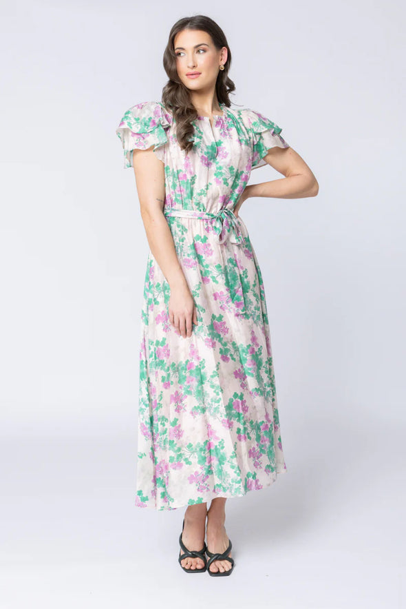 Elegant floral print in the signature Zen Garden pattern

V-neckline with collar and subtle hook-and-eye closure

Short double-layered butterfly sleeves for a feminine finish

Elasticated waist with removable tie belt for a flattering silhouette

Maxi length with soft, graceful movement

Comfortable cotton lining

Main Fabric: 73% Tencel, 11% Linen, 16% Nylon

Lining: 100% Cotton