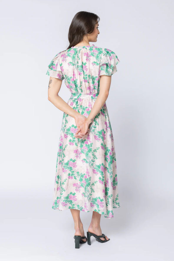 Elegant floral print in the signature Zen Garden pattern

V-neckline with collar and subtle hook-and-eye closure

Short double-layered butterfly sleeves for a feminine finish

Elasticated waist with removable tie belt for a flattering silhouette

Maxi length with soft, graceful movement

Comfortable cotton lining

Main Fabric: 73% Tencel, 11% Linen, 16% Nylon

Lining: 100% Cotton