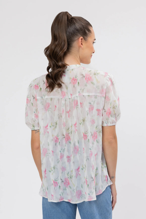 95% Polyester, 5% Spandex

Sheer floral blouse in soft pink Crinkle Blossom print

Delicate pleat detailing for added texture

Puffed short sleeves with a feminine silhouette

Lightweight and versatile for layering or wearing alone
