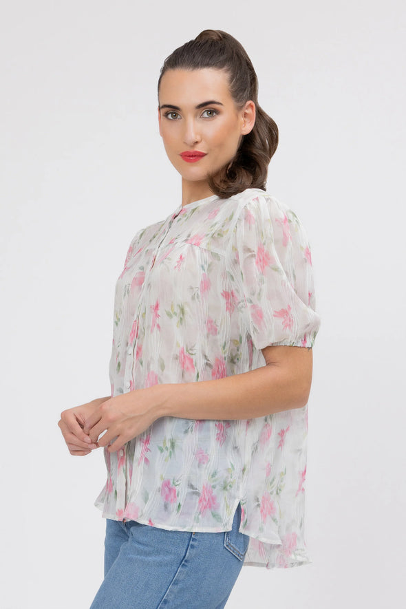 95% Polyester, 5% Spandex

Sheer floral blouse in soft pink Crinkle Blossom print

Delicate pleat detailing for added texture

Puffed short sleeves with a feminine silhouette

Lightweight and versatile for layering or wearing alone