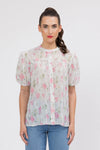 95% Polyester, 5% Spandex

Sheer floral blouse in soft pink Crinkle Blossom print

Delicate pleat detailing for added texture

Puffed short sleeves with a feminine silhouette

Lightweight and versatile for layering or wearing alone
