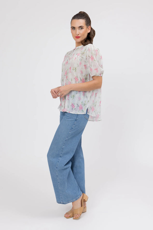 95% Polyester, 5% Spandex

Sheer floral blouse in soft pink Crinkle Blossom print

Delicate pleat detailing for added texture

Puffed short sleeves with a feminine silhouette

Lightweight and versatile for layering or wearing alone