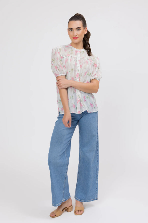 95% Polyester, 5% Spandex

Sheer floral blouse in soft pink Crinkle Blossom print

Delicate pleat detailing for added texture

Puffed short sleeves with a feminine silhouette

Lightweight and versatile for layering or wearing alone