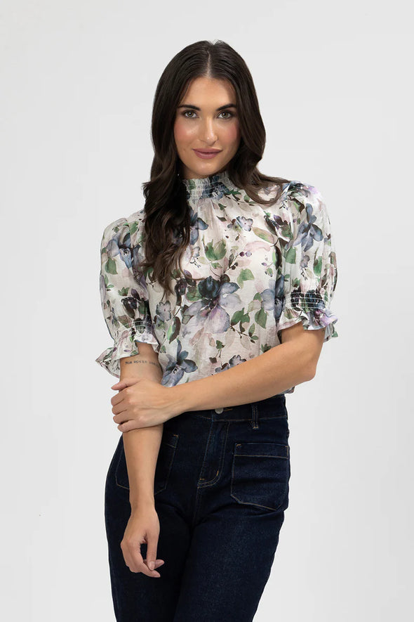 Chic and feminine, the Seeking Lola Notting Hill Top in Water Bloom Print is a lightweight floral blouse perfect for effortless everyday style.