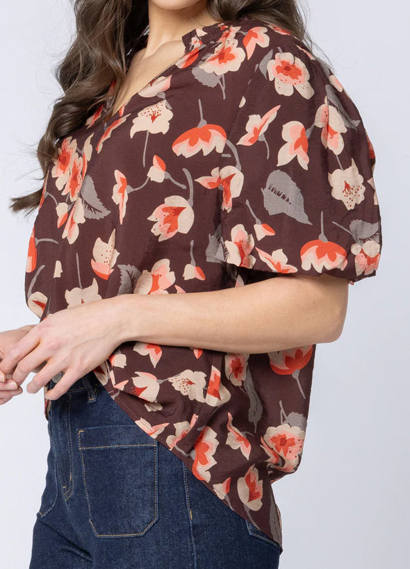 Soft cotton-blend fabric for comfort and breathability

Flattering V-neckline with frill detailing

3/4 puff sleeves for a feminine, stylish silhouette

Shaped back hem for a flattering finish

Ideal for seasonal transitions and everyday wear

Beautiful floral print for an elevated, timeless look