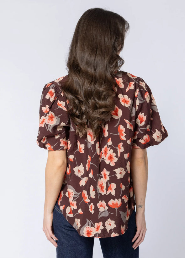 Soft cotton-blend fabric for comfort and breathability

Flattering V-neckline with frill detailing

3/4 puff sleeves for a feminine, stylish silhouette

Shaped back hem for a flattering finish

Ideal for seasonal transitions and everyday wear

Beautiful floral print for an elevated, timeless look